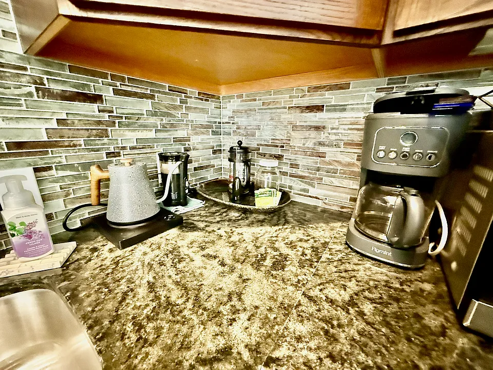 Close up of tile and granite at the beverage bar