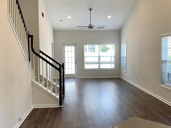 Living, Dining and leading stairs to upper level.