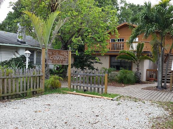 The triplex also has visitor parking spaces shared with the