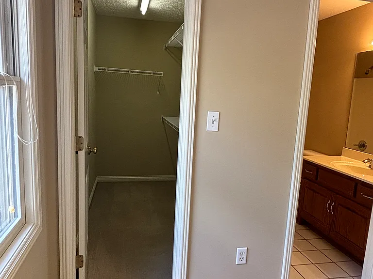 Walk-in closet and bathroom in upstairs spare bedroom