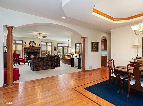 Elegant and open with stately pillars and arched entry!