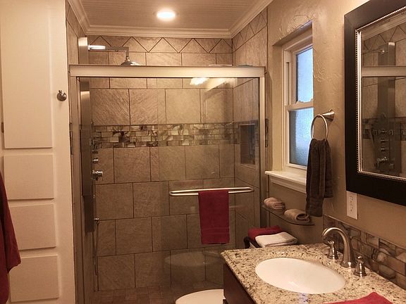 Down To The Studs
						:
						Huge MasterShower/Bath w/ rainshower head and ample storage.