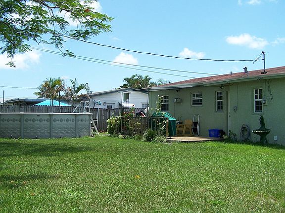 Back with view of pool