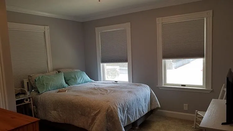 Large bedroom with room darkening cordless cellular blinds & central air