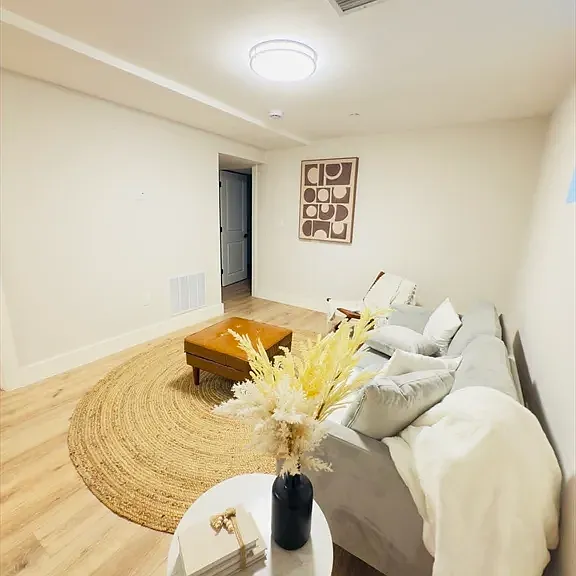 Expansive lower-level family room: An incredible second living area for movie nights, a home gym, or a spacious lounge.