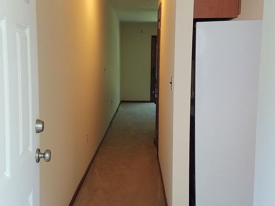 Walking into your new condo - a hallway to the Living Room and the Kitchen immediately to your right as you walk in the door