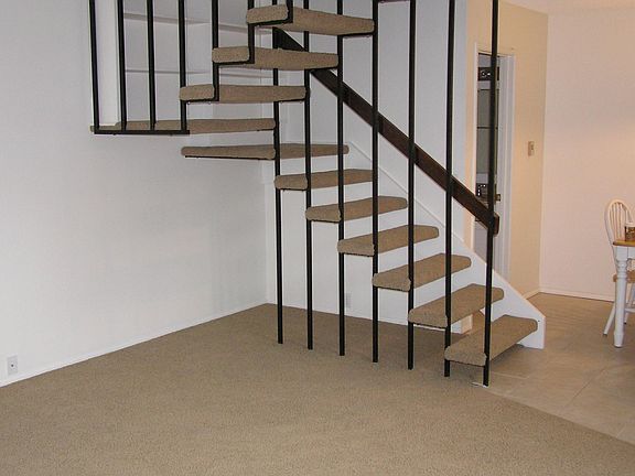 Stairs with half-bath behind