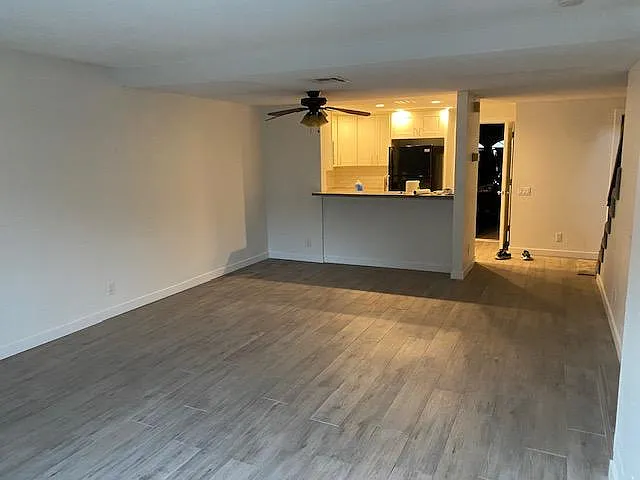 Roomy living room looking towards the kitchen - 5151 Walnut Ave #29