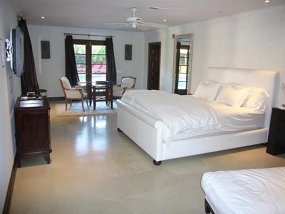 Master suite with french doors and laminate floors