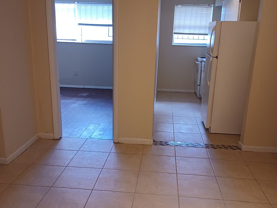 Inside the living room looking into the bedroom and kitchen