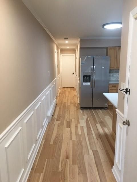 living room hallway facing the kitchen hallway