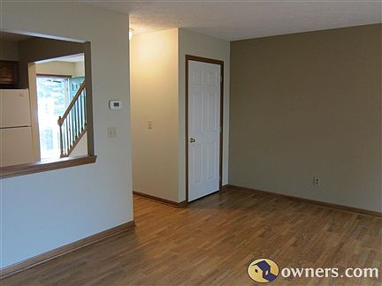 Living room with accent wall and wood (laminate) floors