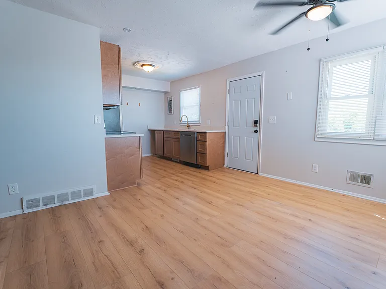 Newly designed kitchen with new cabinets, countertops, sink, hardware, and flooring