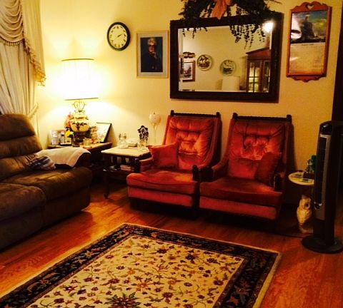 The front door of Living Room is in an small entry at the end of the sofa and recessed back,