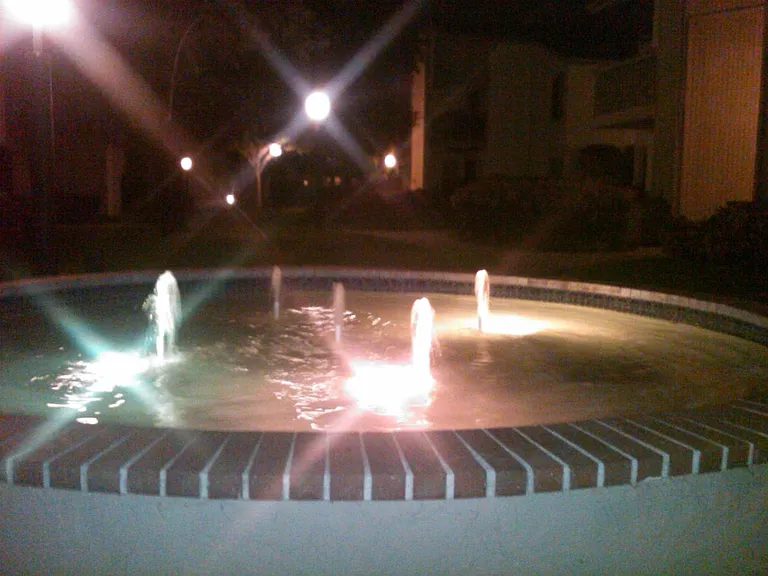 fountains at night in courtyard
