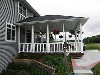 Side view of covered porch and patio.