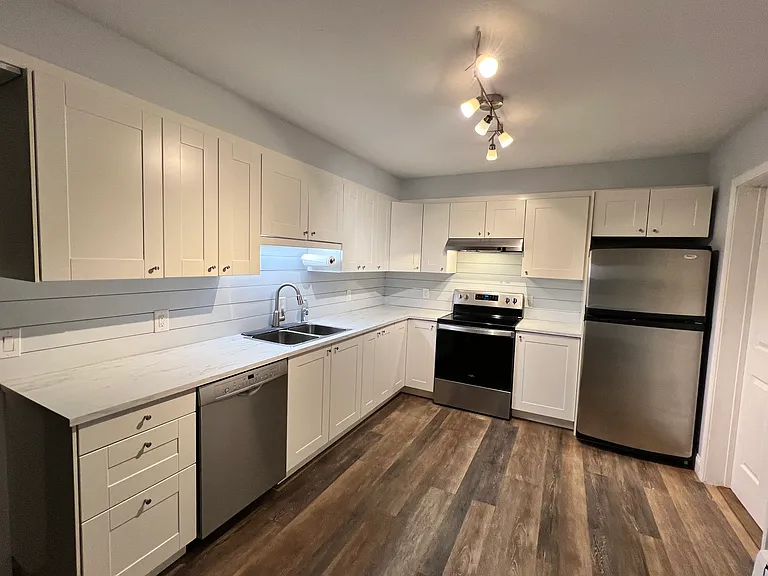 Large updated kitchen with all new stainless steel appliances.