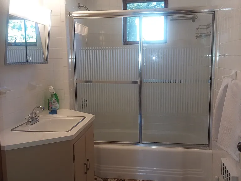 White fully tiled Bathroom
