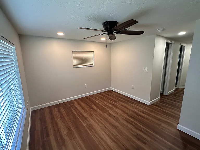 Master bedroom offers a private retreat with soft lighting and separate restroom/shower