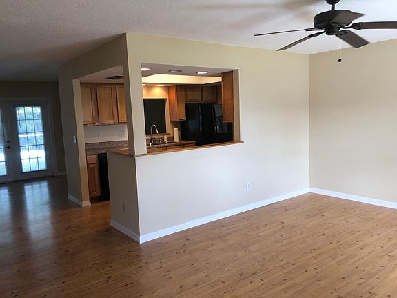 Main living room looking toward kitchen.