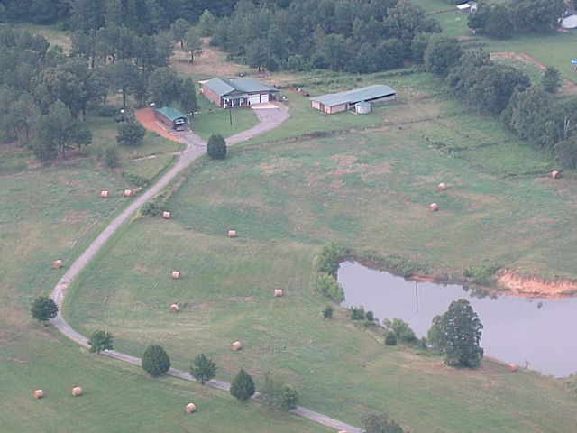 Aerial from road to house