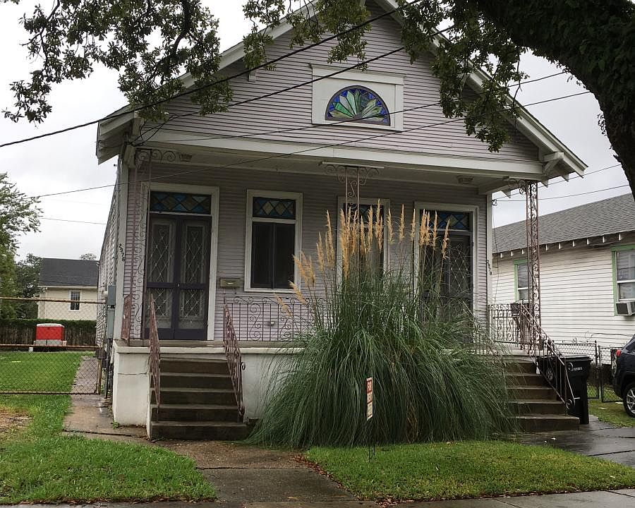 Front of the shotgun double. Available apartment is on the left.
