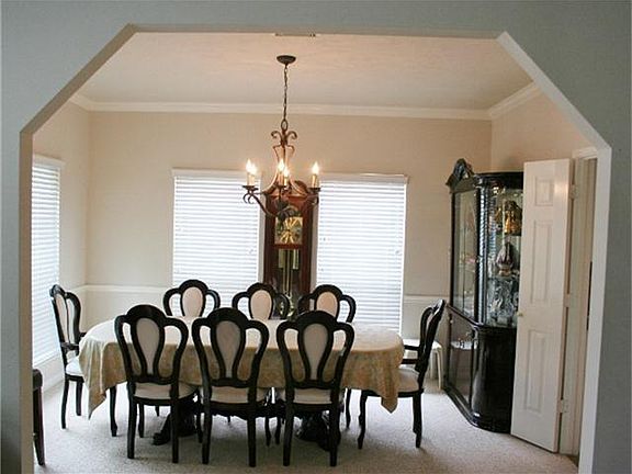 Large formal dining area  with lots of windows
