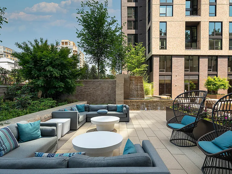Spacious outdoor courtyard with water feature