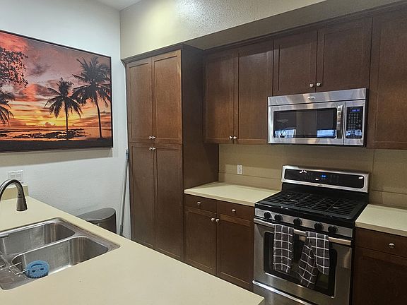 Kitchen features plentiful storage cabinets