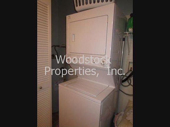 Stack washer/dryer inside the closet.
