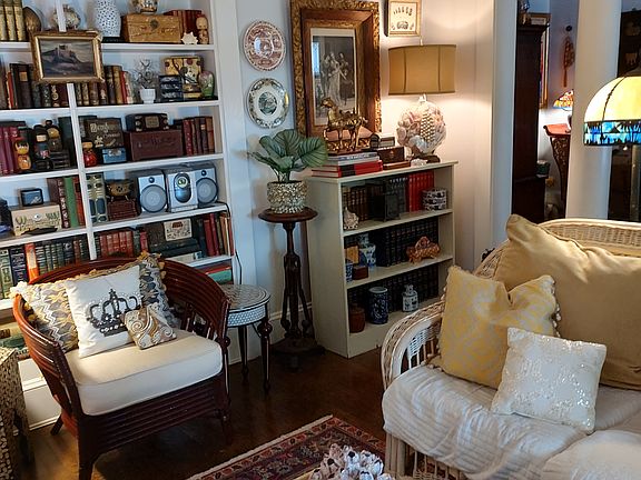 Living Room w/ Built In Bookshleves.