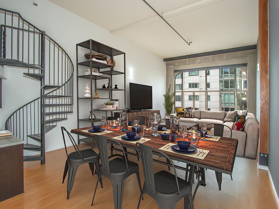 Soaring 16 ft ceilings in open dining/ living area with eastern outlooks provide plenty of morning sunlight.