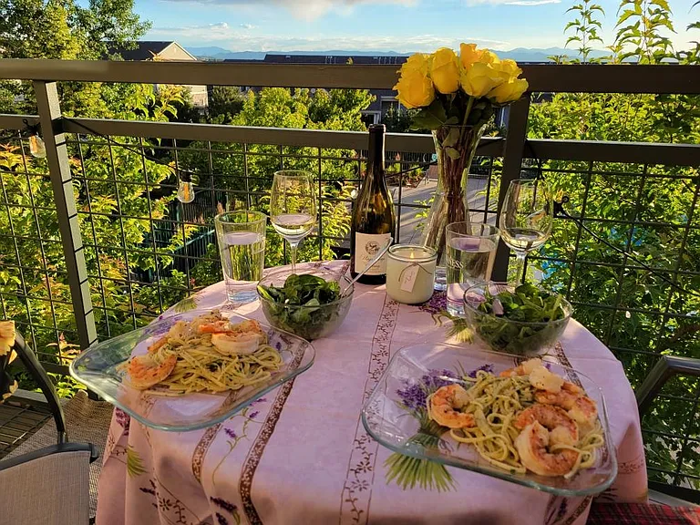 Enjoy a meal among the beautiful trees flanking the balcony during the summertime