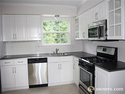 Modern White kitchen with Modern Stainless Steel Appliances