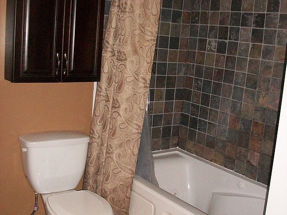 Bathroom, with whirlpool bath and tumbled slate surround