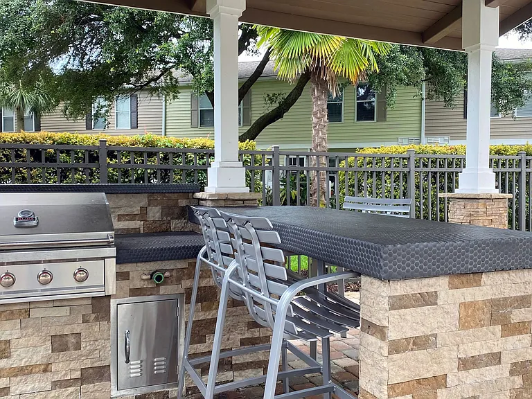 Savor the satisfaction of becoming a grill master at our outdoor kitchen offering a delightful al fresco culinary adventure.