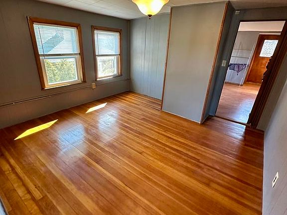 bedroom with large walk in closet with additional ample eave storage