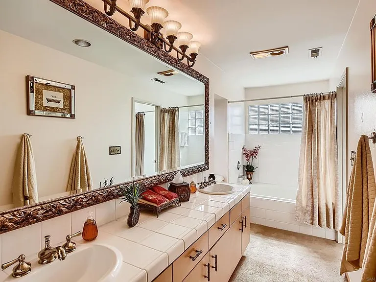 master bath with sunken tub and walk in shower