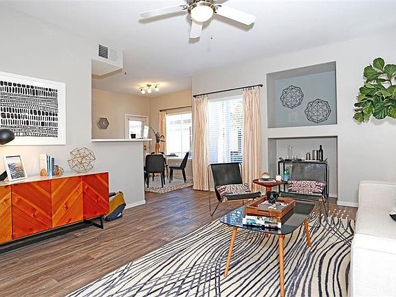 Wood-look flooring runs through the living spaces of select