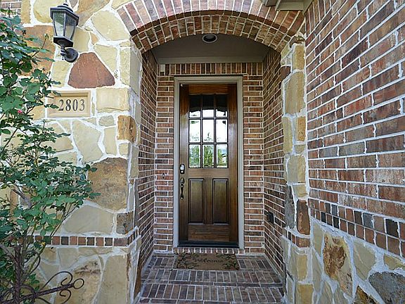 Front doorway with stone accents inviting you inside.