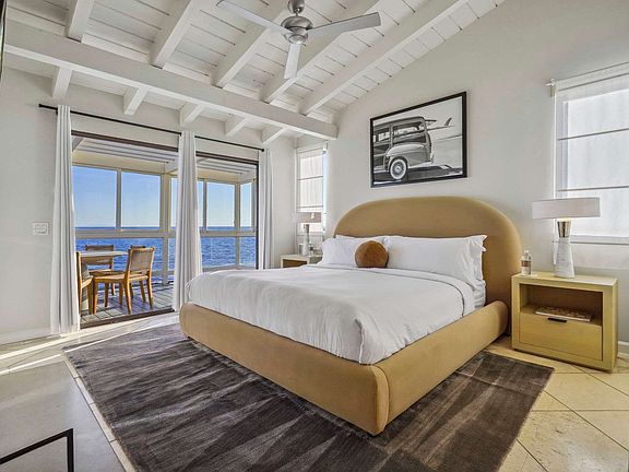 Drift to sleep in the primary suite with a king bed and private balcony access.