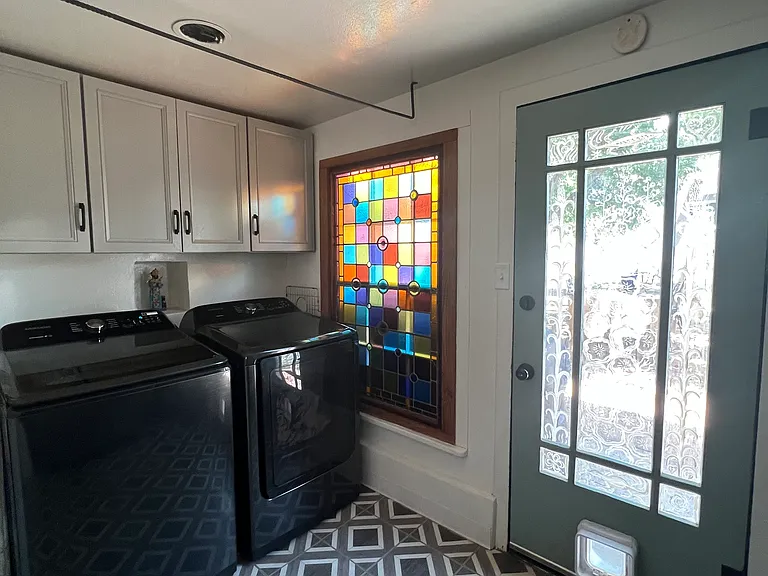 Laundry room with new large-load washer and dryer
