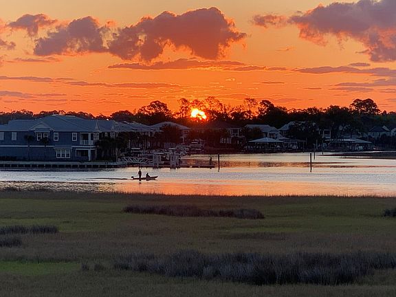 Morning sunrise off the top patio balcony adjacent to the master bedroom