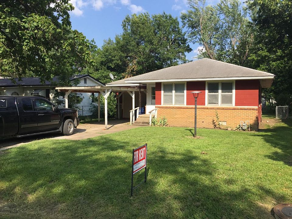 Front yard w, carport.