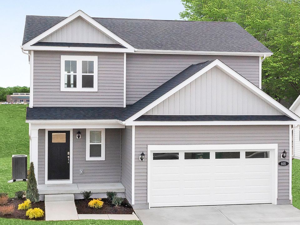 2 Story home with covered front entry of a DRB Homes Glenshaw plan at The Village of College Park.