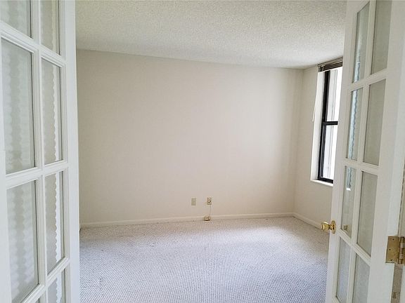 French doors to enter the 2nd bedroom.