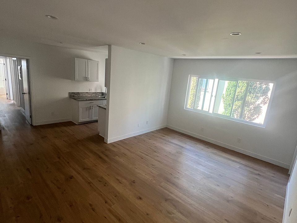 Living room, breakfast area. Recessed lighting, brand new floors, kitchen, and windows, Storage closet in main living area as well
