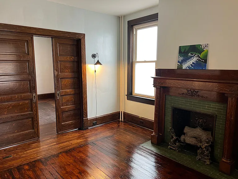 fireplace and pocket doors in bedroom