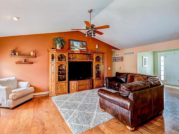 Large great room with vaulted ceilings and entry foyer.