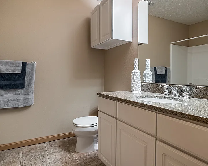 Our bathrooms feature large mirrors, overhead lighting, and plenty of storage space making getting ready for the day a breeze.